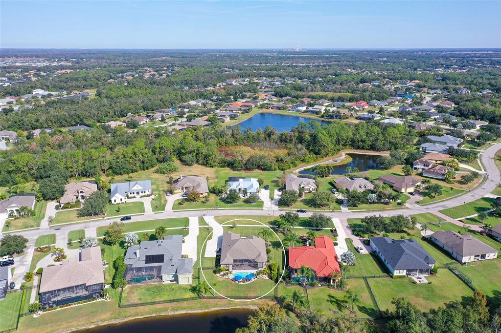 15425 Mulholland Road Parrish, FL 34219 - Photo 61 of 67 an aerial view of residential houses with outdoor space