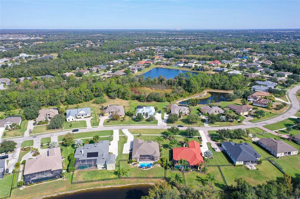15425 Mulholland Road Parrish, FL 34219 - Photo 62 of 67 an aerial view of residential houses with outdoor space