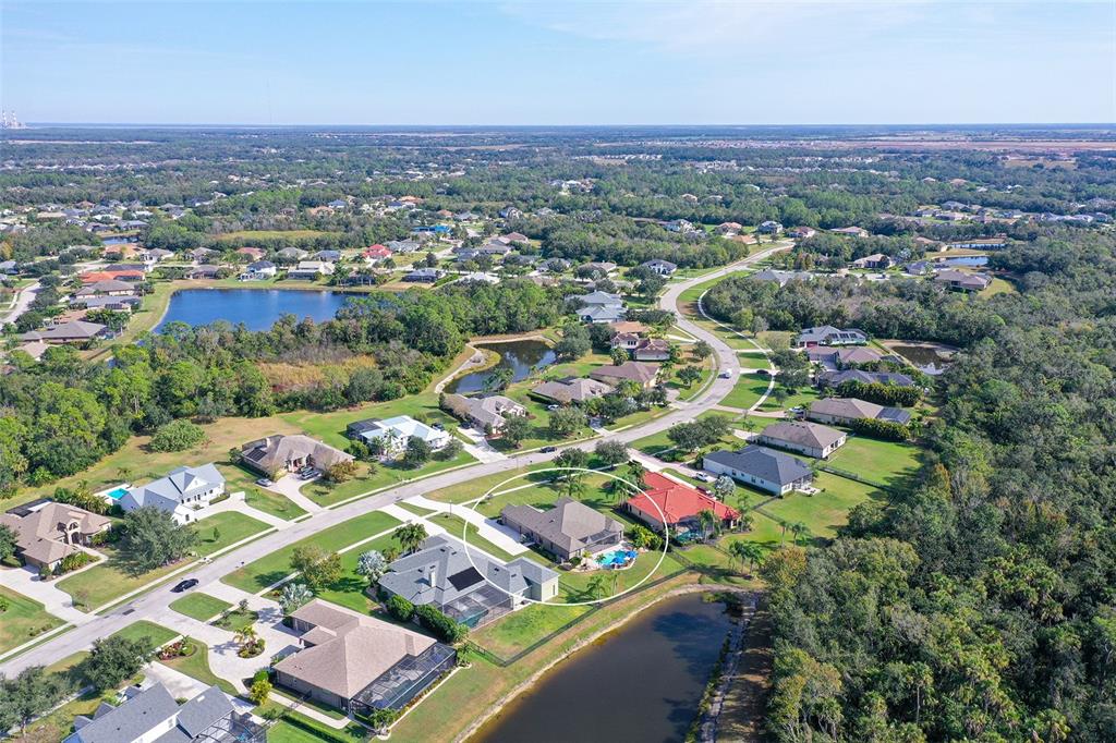 15425 Mulholland Road Parrish, FL 34219 - Photo 63 of 67 an aerial view of a city with lots of residential buildings