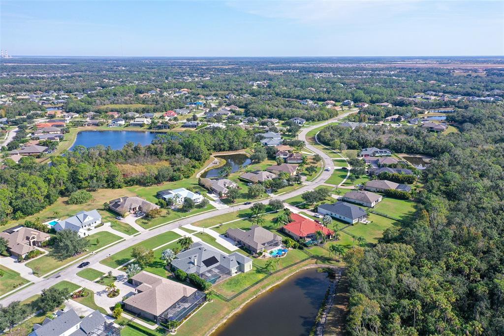 15425 Mulholland Road Parrish, FL 34219 - Photo 64 of 67 an aerial view of residential houses with outdoor space