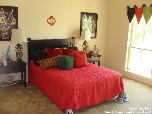 8835 Napa Landing Boerne, TX 78015 - Photo 12 of 21 a bedroom with a bed and a window