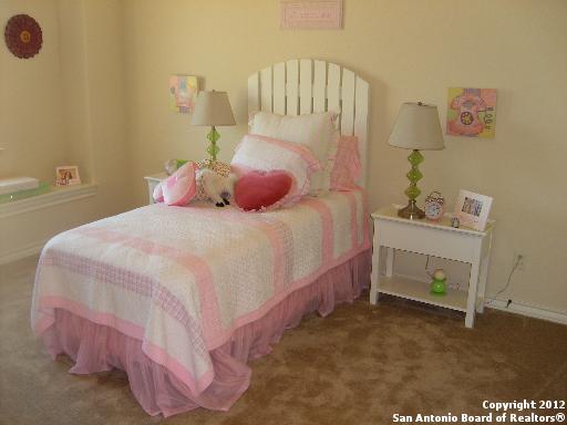8835 Napa Landing Boerne, TX 78015 - Photo 14 of 21 a bedroom with a bed and a window