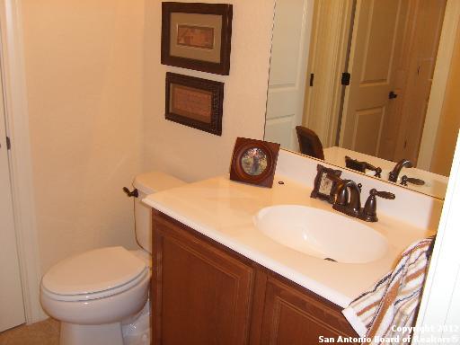8835 Napa Landing Boerne, TX 78015 - Photo 16 of 21 a bathroom with a sink toilet and mirror