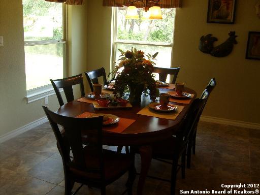 8835 Napa Landing Boerne, TX 78015 - Photo 5 of 21 a view of a dining room with furniture window and outside view