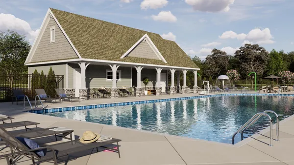 a view of a house with pool and chairs