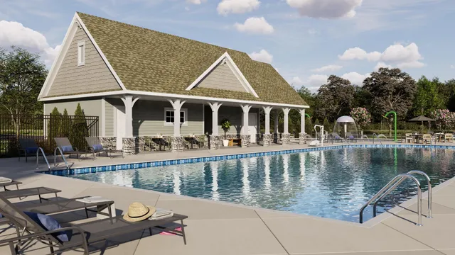 a view of a house with pool and chairs