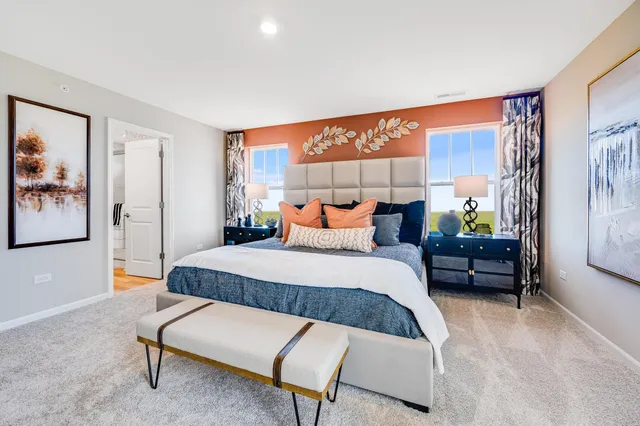 a bedroom with furniture and a window