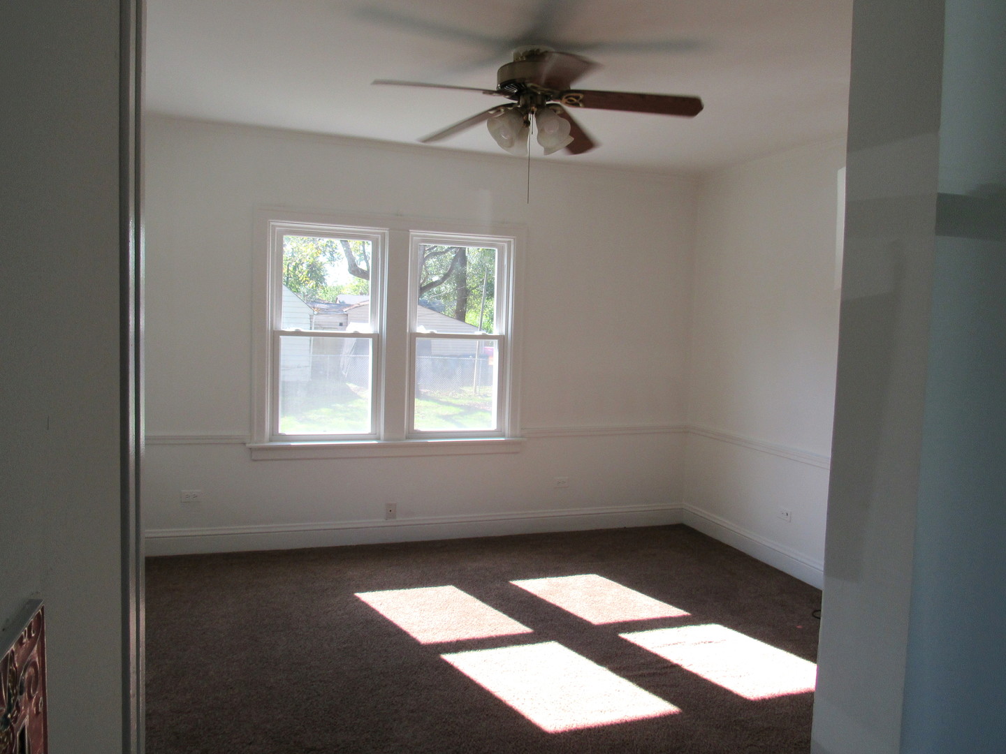 14446 Ridgeway Avenue Midlothian, IL 60445 - Photo 13 of 18 an empty room with a window