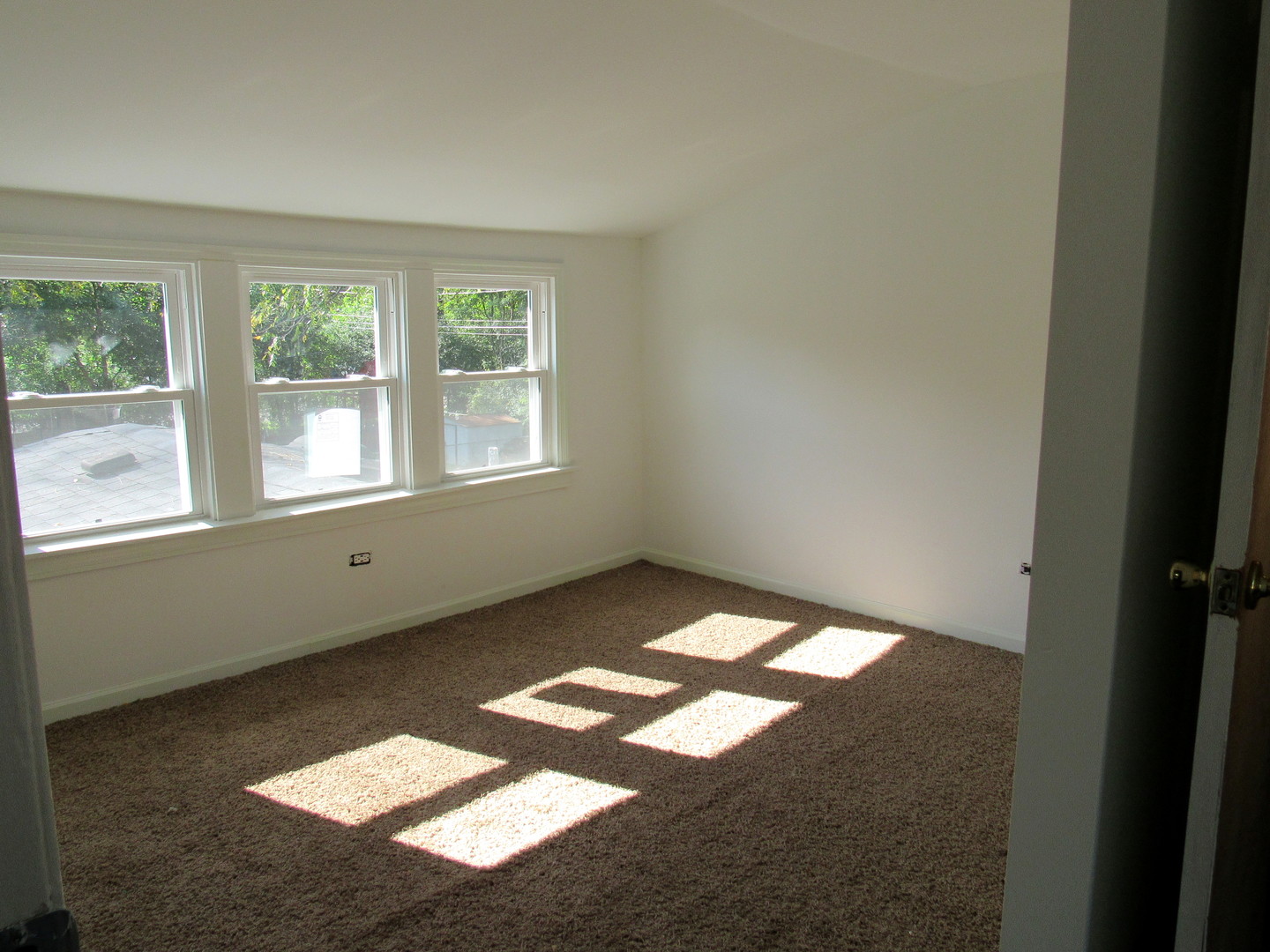 14446 Ridgeway Avenue Midlothian, IL 60445 - Photo 14 of 18 a view of an empty room with a window