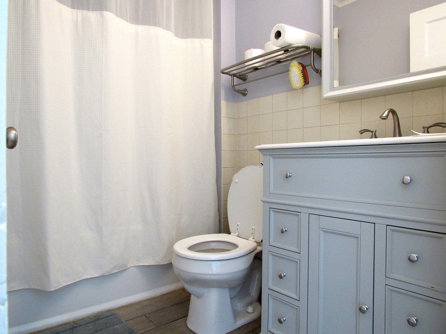 14446 Ridgeway Avenue Midlothian, IL 60445 - Photo 17 of 18 a bathroom with a toilet and a sink