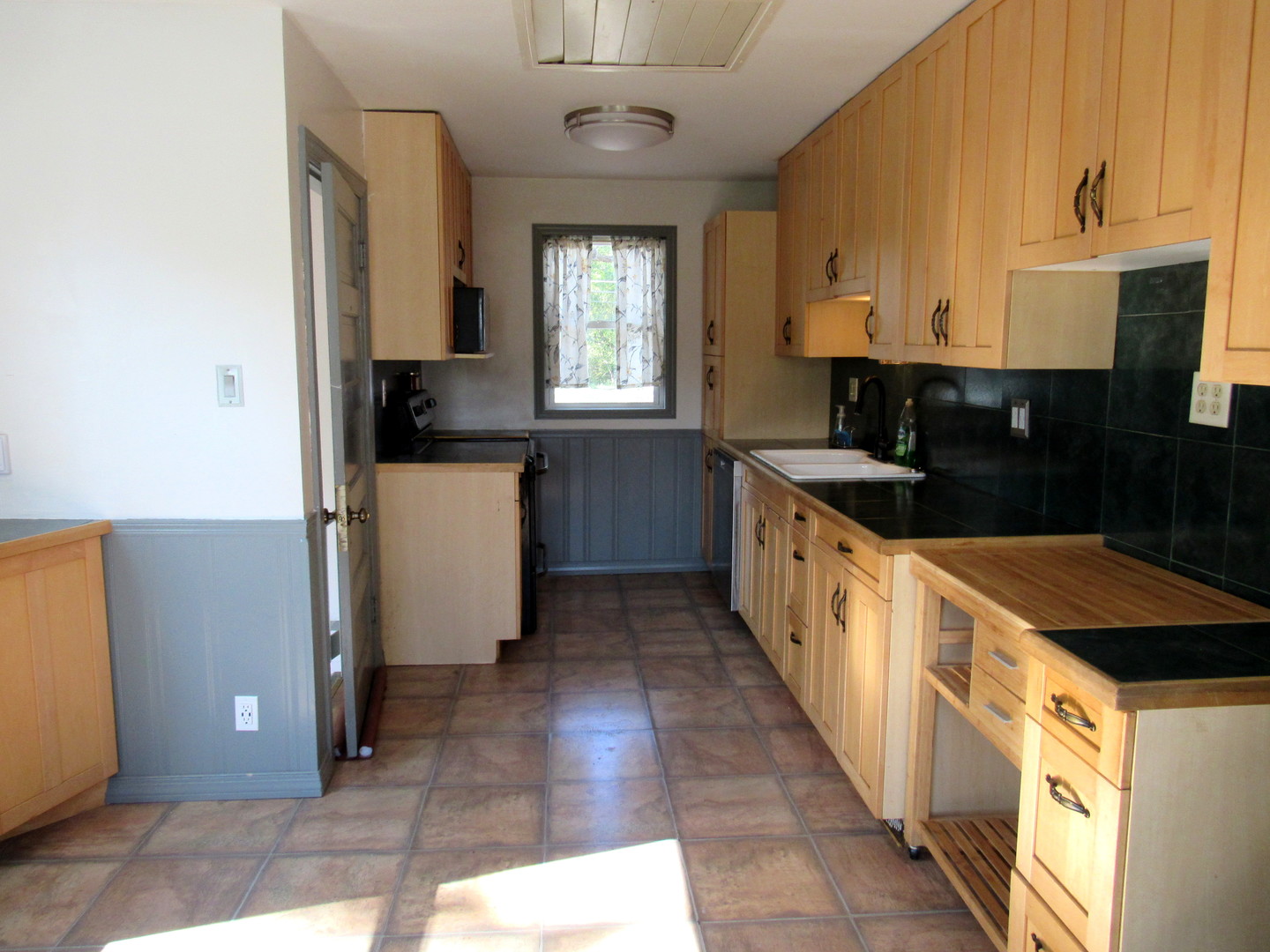 14446 Ridgeway Avenue Midlothian, IL 60445 - Photo 7 of 18 a kitchen with a sink a stove and cabinets