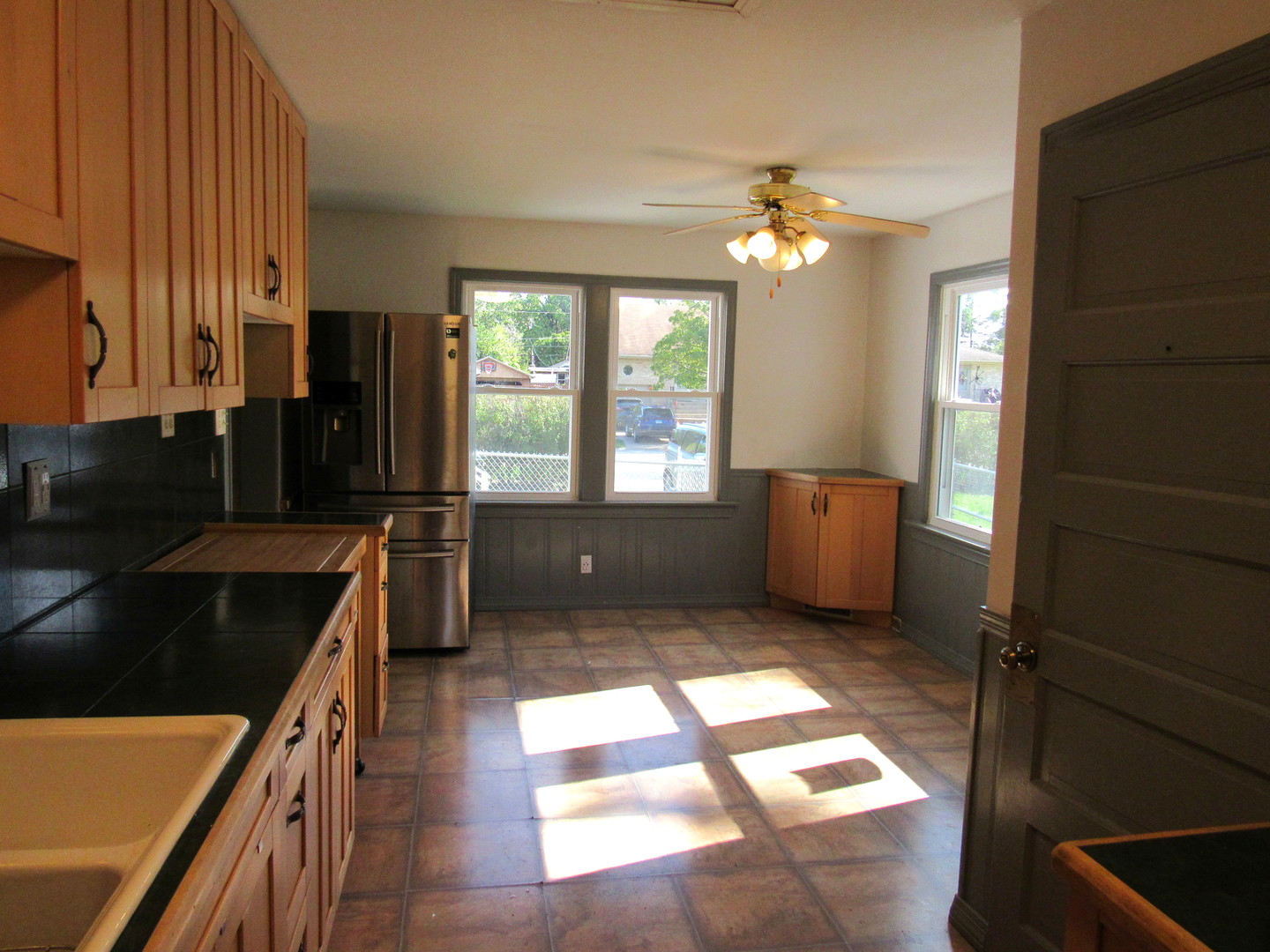 14446 Ridgeway Avenue Midlothian, IL 60445 - Photo 8 of 18 a kitchen with granite countertop a stove a sink and a refrigerator