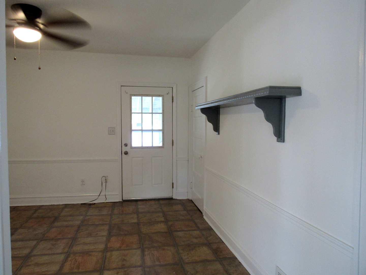14446 Ridgeway Avenue Midlothian, IL 60445 - Photo 10 of 18 a view of an empty room with windows