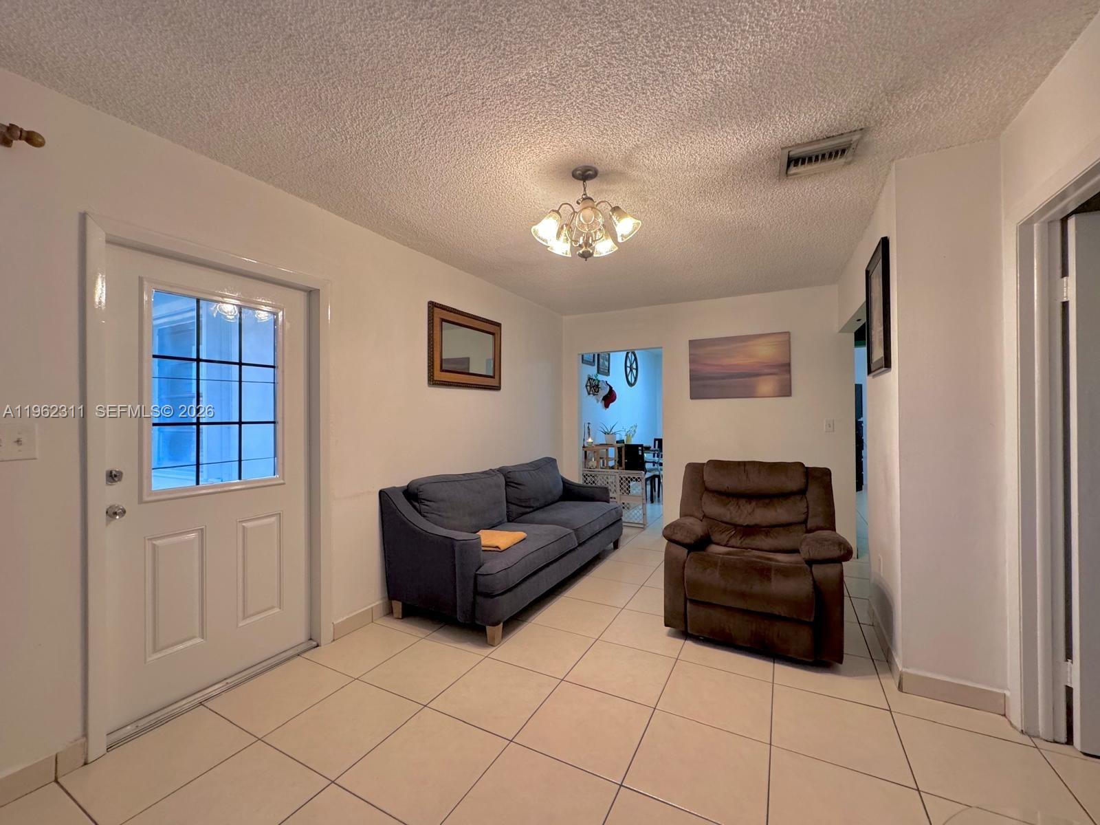 367 East 20th Street, Unit 369 Hialeah, FL 33010 - Photo 3 of 10 a living room with furniture