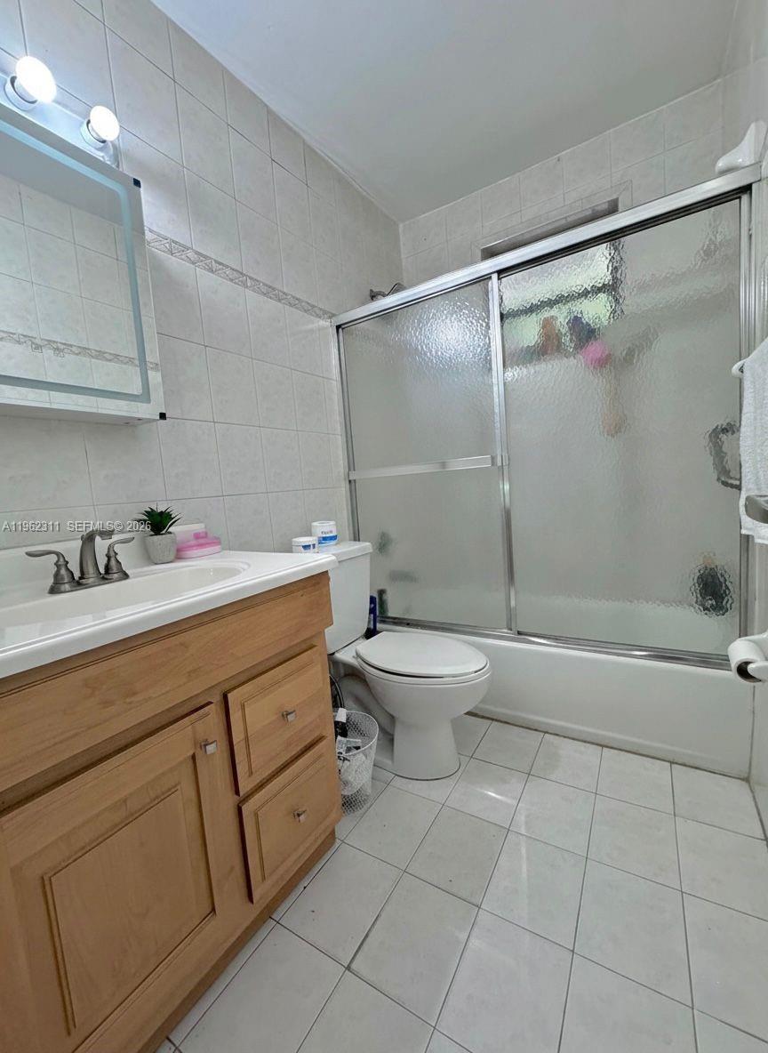 367 East 20th Street, Unit 369 Hialeah, FL 33010 - Photo 8 of 10 a bathroom with a sink toilet and shower