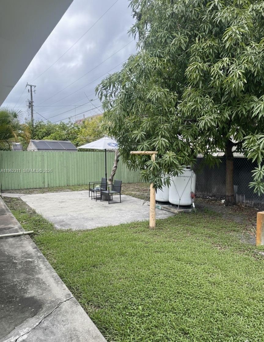 367 East 20th Street, Unit 369 Hialeah, FL 33010 - Photo 10 of 10 a view of a garden with a bench and a lake view