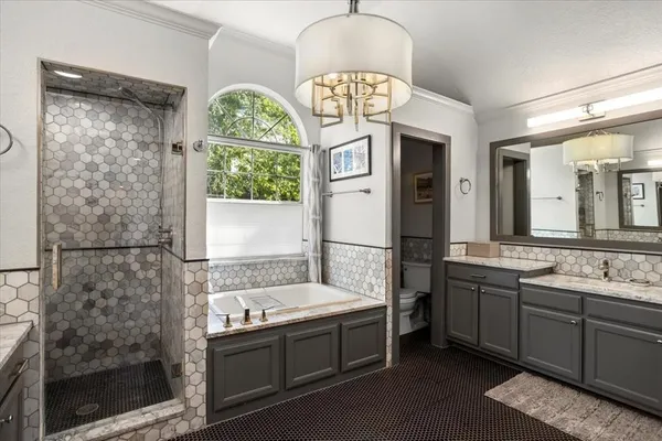 a bathroom with a sink a mirror and a bathtub