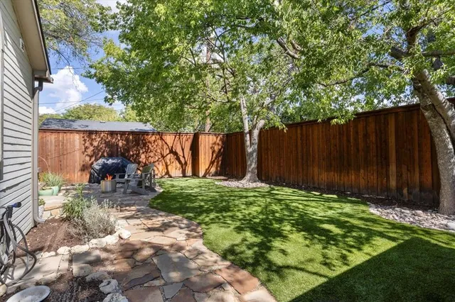 a backyard of a house with lots of green space