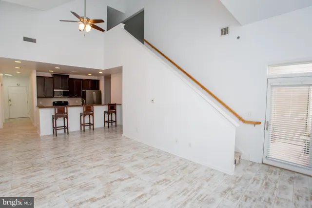 a view of kitchen with furniture and wooden floor