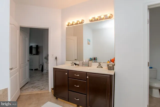 a bedroom with a bed and a closet