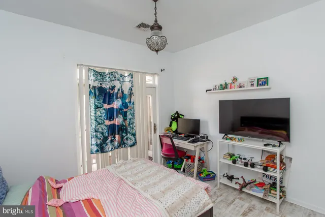 a room with furniture and a flat screen tv