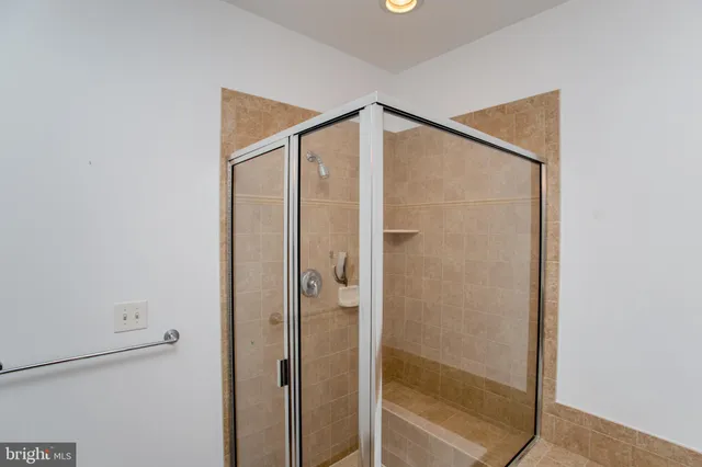 a view of an empty room and wooden floor