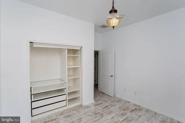 a bathroom with a sink mirror and a shower