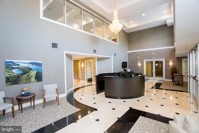 a view of a living room and kitchen floor to ceiling window