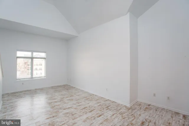a kitchen with stainless steel appliances granite countertop a sink refrigerator and cabinets
