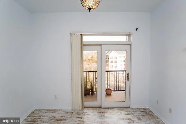 a view of a hallway to a bedroom