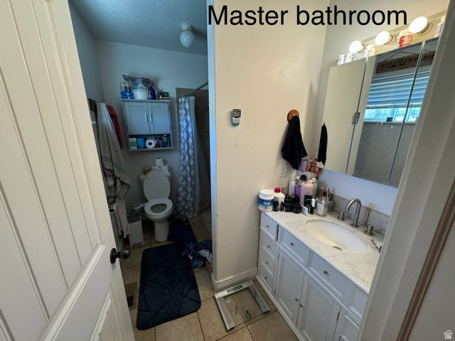 4355 Sagebrush Drive Enoch, UT 84721 - Photo 12 of 13 Bathroom with a shower with curtain, light tile patterned floors, and vanity