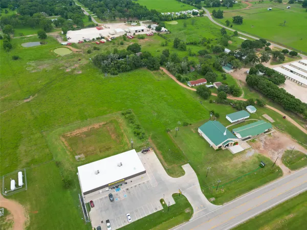 an aerial view of a house with a garden