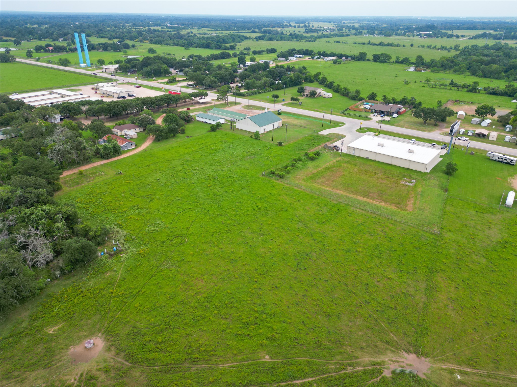 2 Fm 1488 Road Waller, TX 77484 - Photo 24 of 28 an aerial view of residential houses with outdoor space and trees