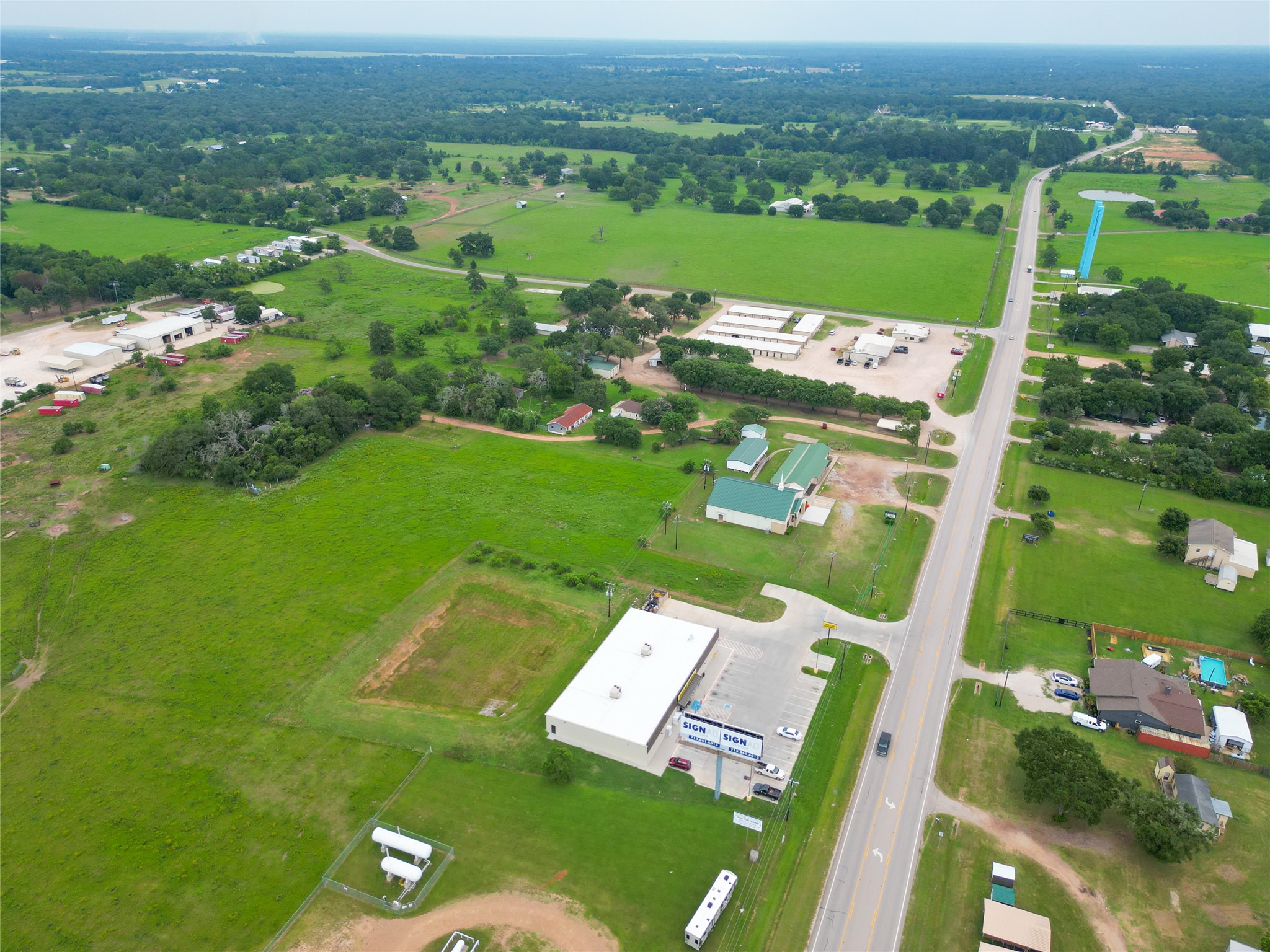 2 Fm 1488 Road Waller, TX 77484 - Photo 26 of 28 an aerial view of a residential houses with outdoor space and trees