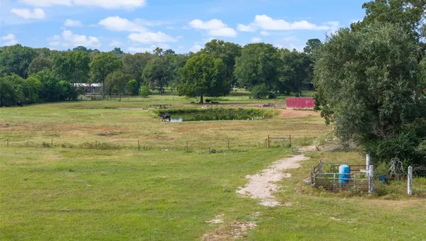 a view of a lake with a yard