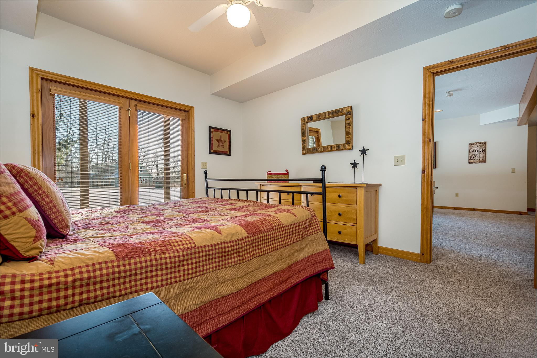 41 Wilson Circle Swanton, MD 21561 - Photo 37 of 63 a bedroom with a bed and wooden floor