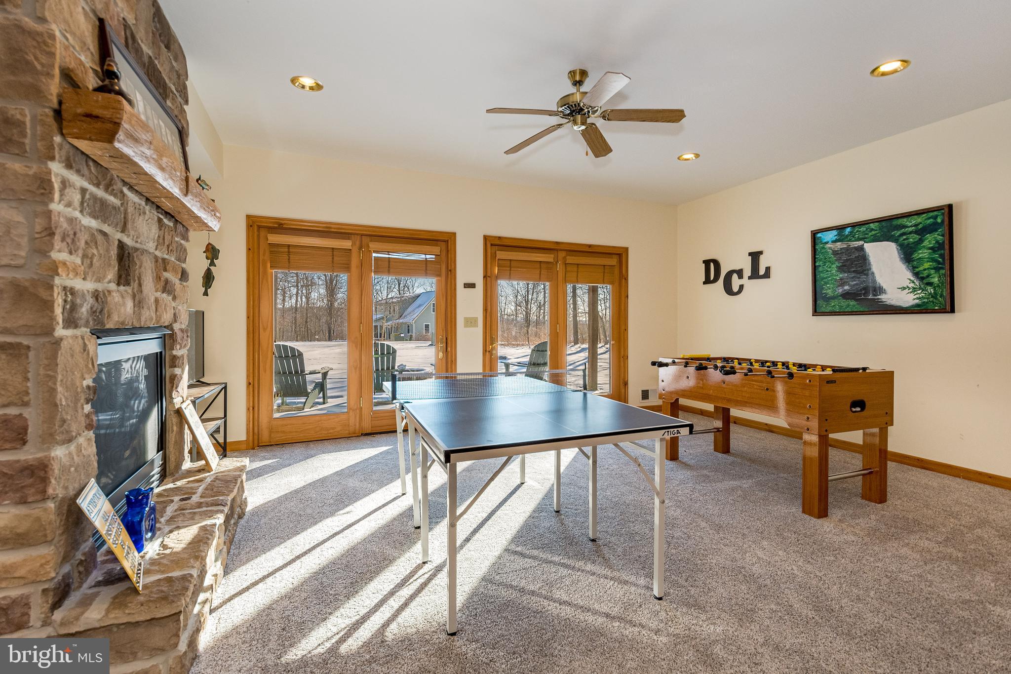41 Wilson Circle Swanton, MD 21561 - Photo 41 of 63 a living room with furniture a flat screen tv and a floor to ceiling window