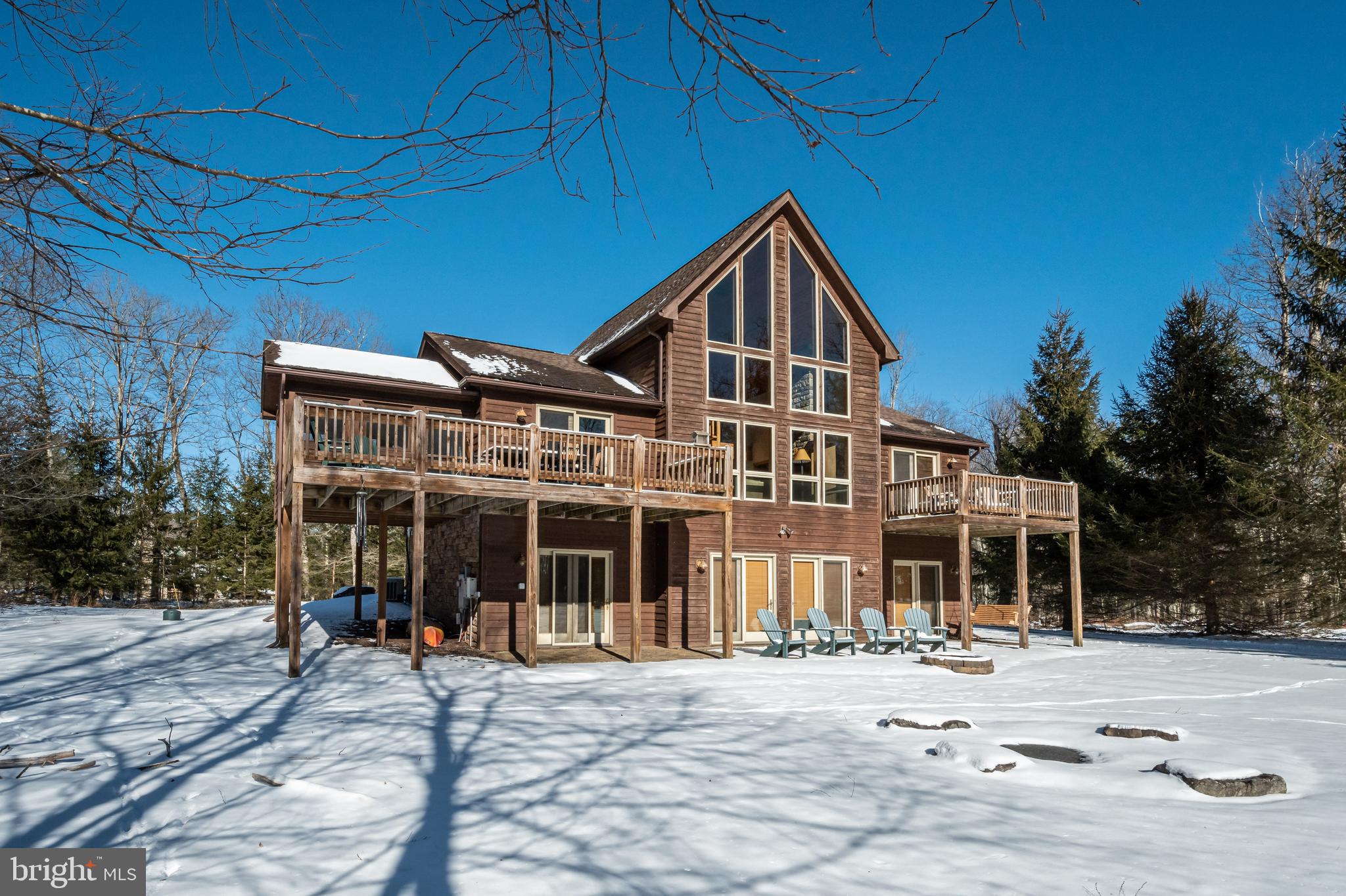 41 Wilson Circle Swanton, MD 21561 - Photo 51 of 63 a front view of a house with a yard and glass windows
