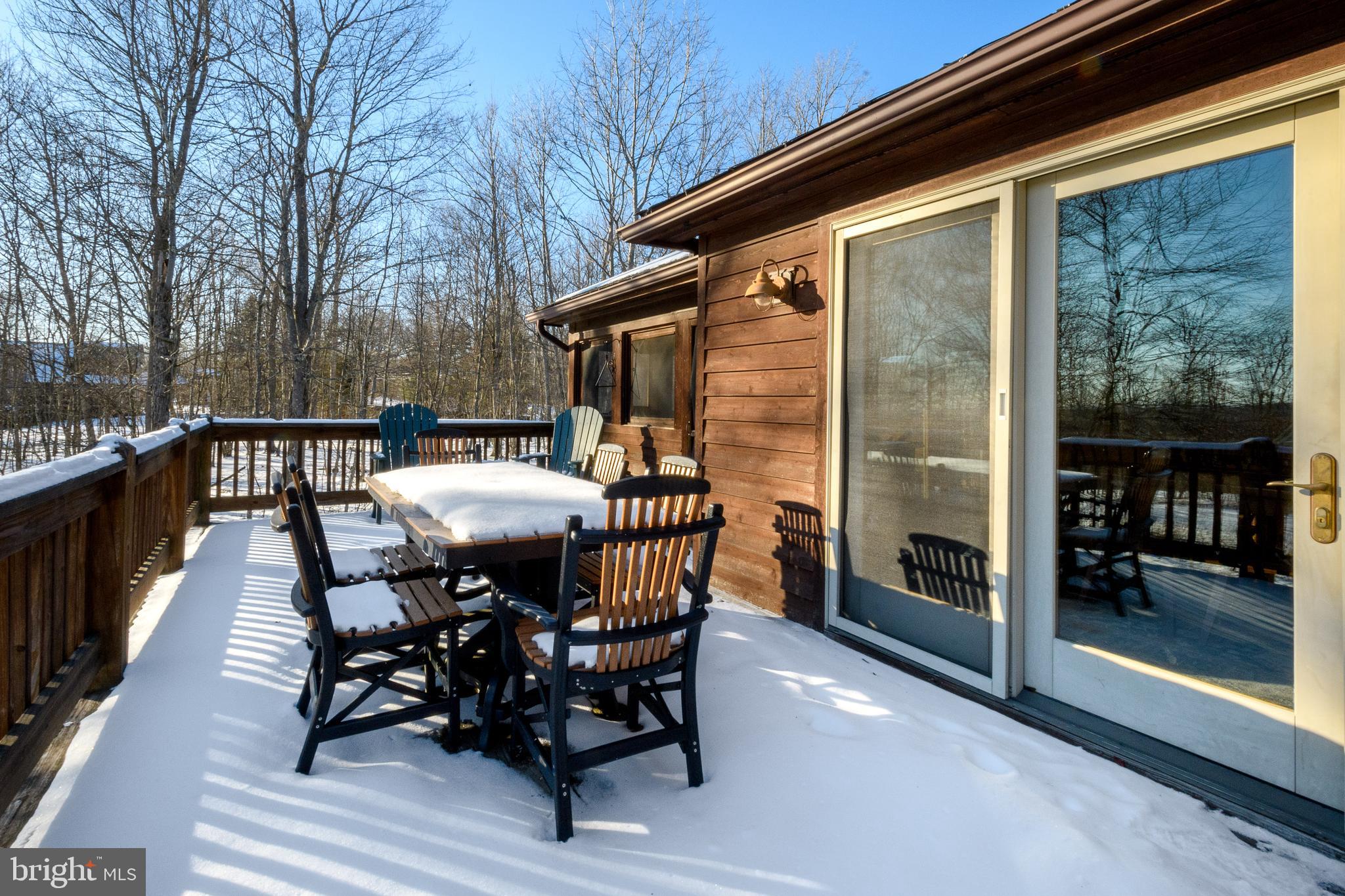 41 Wilson Circle Swanton, MD 21561 - Photo 53 of 63 a view of a chairs and table on the balcony