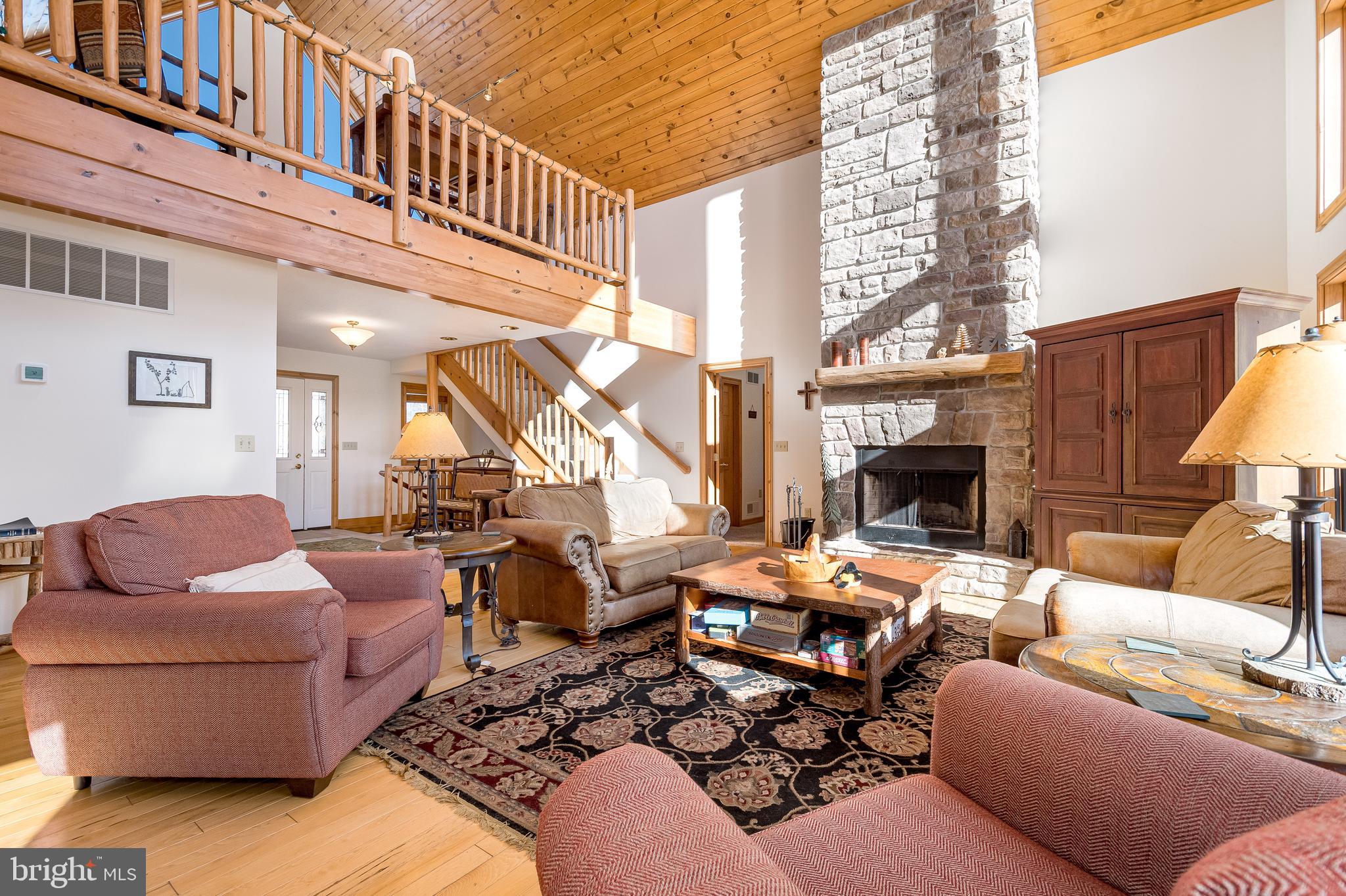 41 Wilson Circle Swanton, MD 21561 - Photo 7 of 63 a outdoor living space with patio furniture and a fireplace