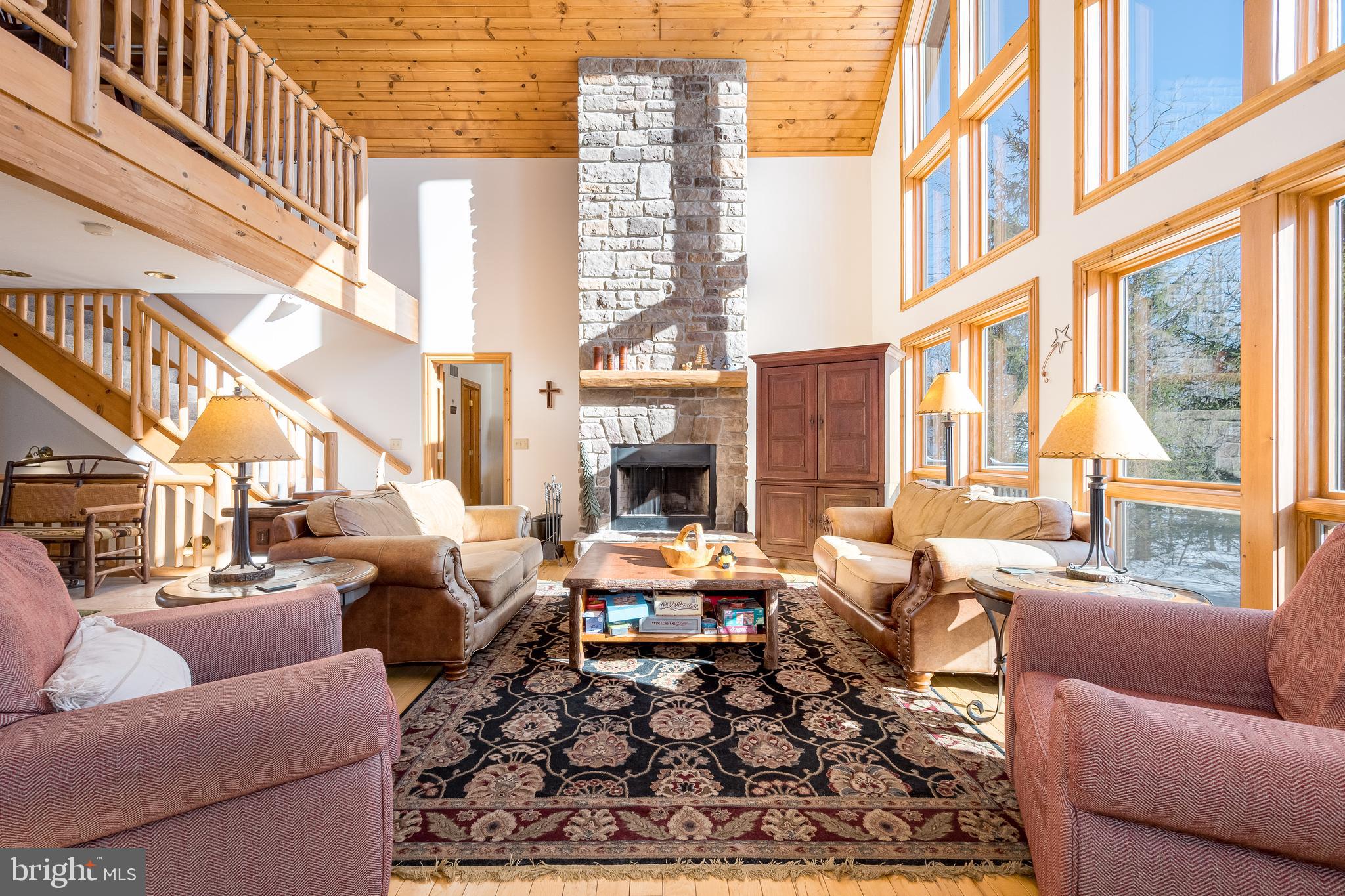 41 Wilson Circle Swanton, MD 21561 - Photo 8 of 63 a living room with furniture a fireplace and a large window