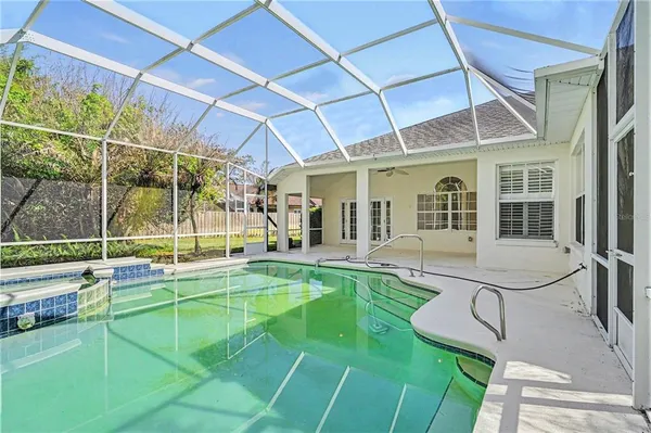 a view of a house with a backyard