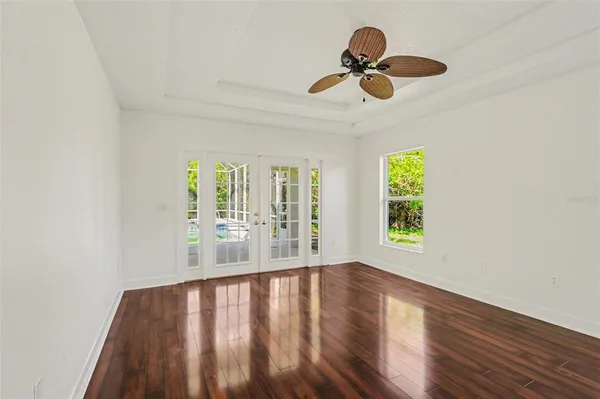 a view of an entryway with wooden floor