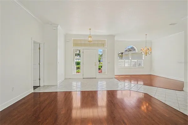 an entryway with wooden floor