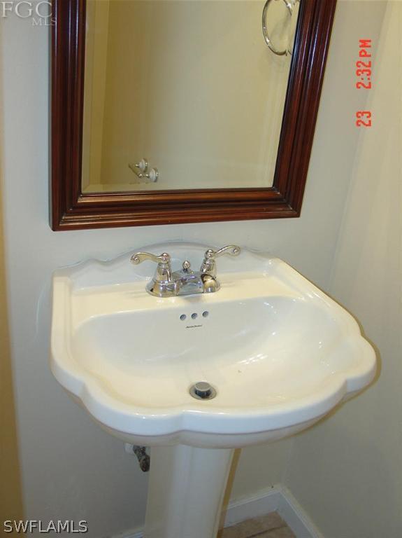 15921 Cemetery Road Fort Myers, FL 33905 - Photo 16 of 25 a bathroom with a sink and a mirror