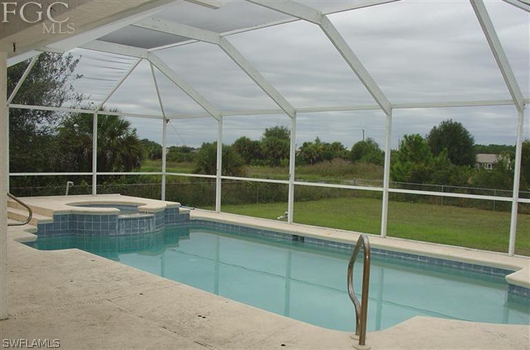 15921 Cemetery Road Fort Myers, FL 33905 - Photo 5 of 25 a view of a garden with a swimming pool