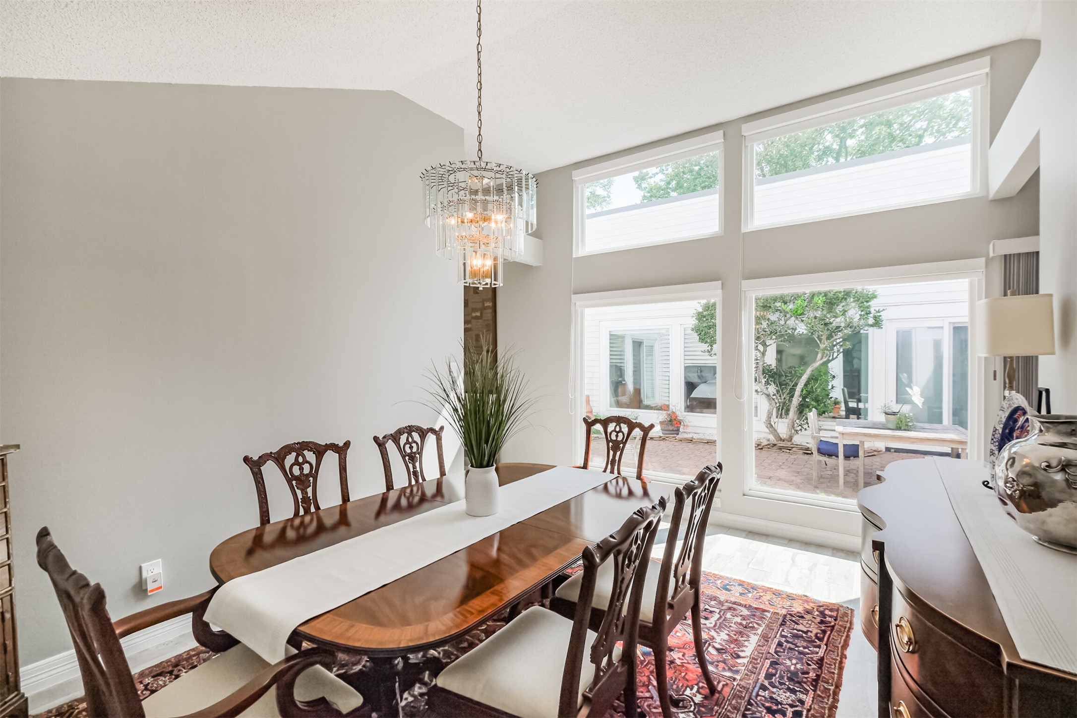 1007 Arrow Hill Road Houston, TX 77077 - Photo 10 of 48 Another view of the formal dining room shows the peaceful views of the courtyard through the double pane windows.