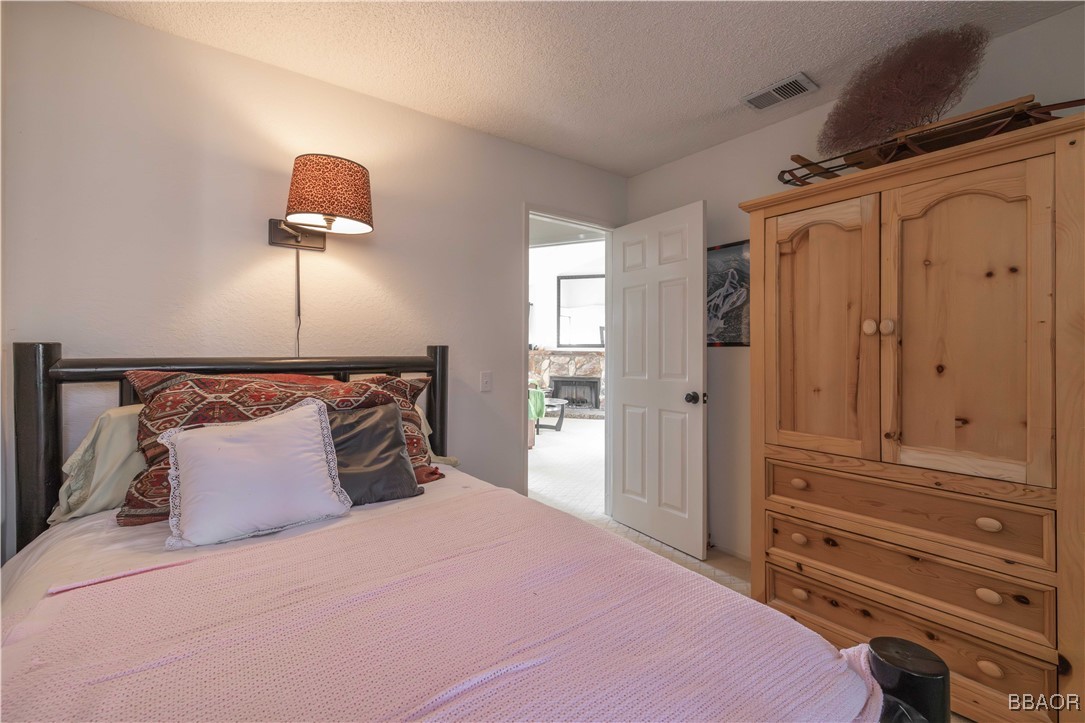 760 Blue Jay Road, Unit 34 Big Bear Lake, CA 92315 - Photo 18 of 24 a bedroom with a bed and a closet