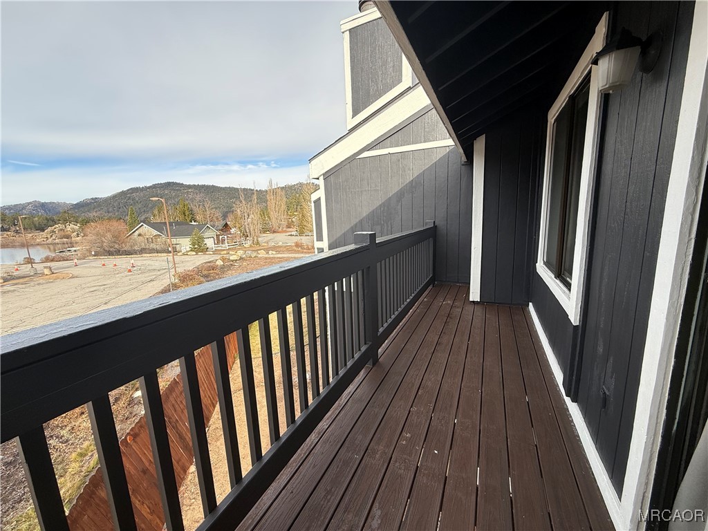 760 Blue Jay Road, Unit 34 Big Bear Lake, CA 92315 - Photo 2 of 24 a view of a balcony with wooden floor