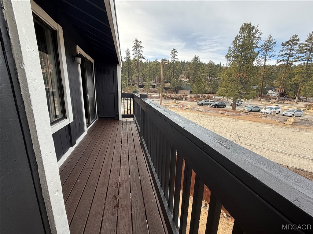 760 Blue Jay Road, Unit 34 Big Bear Lake, CA 92315 - Photo 23 of 24 a view of balcony and wooden floor